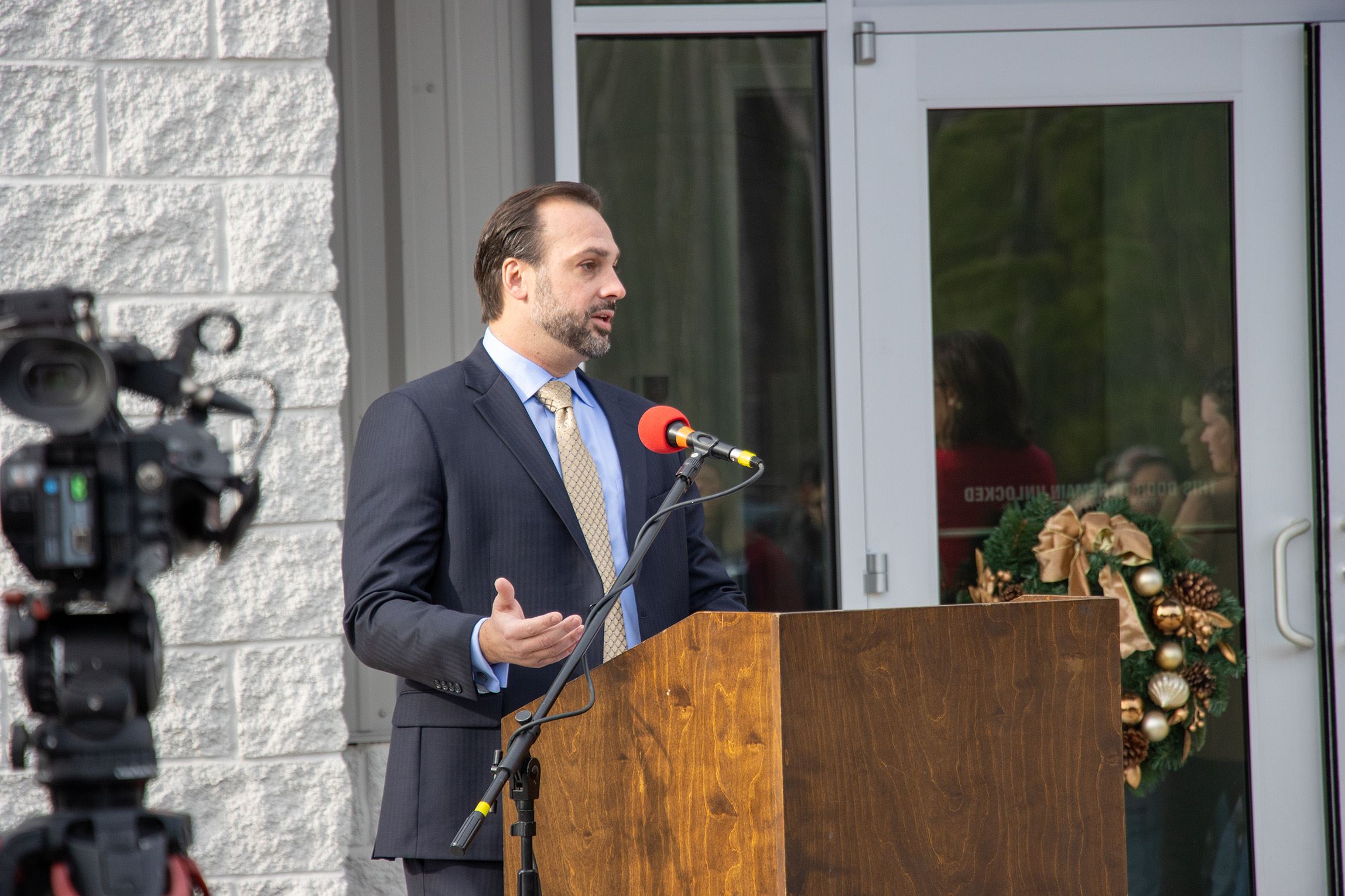 Pharmerica Chief Operating Officer Brett Bearfield speaks at the podium